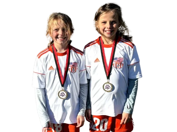 Two kids on the Rebels FC girls soccer team