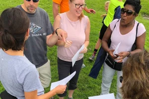 Soccer parents gathered in a group on the field